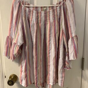 White top with pastel colored and gold stripes